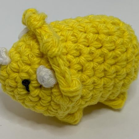 Small hand made crocheted dinosaur amigurumi keychain