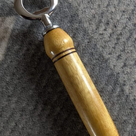 Handmade Iroko bottle opener with a stainless steel opener