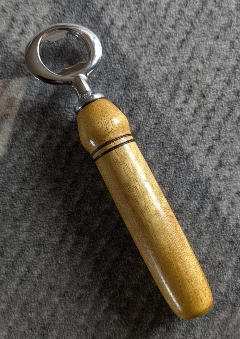 Handmade Iroko bottle opener with a stainless steel opener