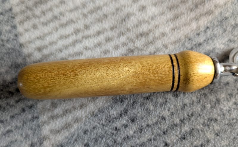Handmade Iroko bottle opener with a stainless steel opener
