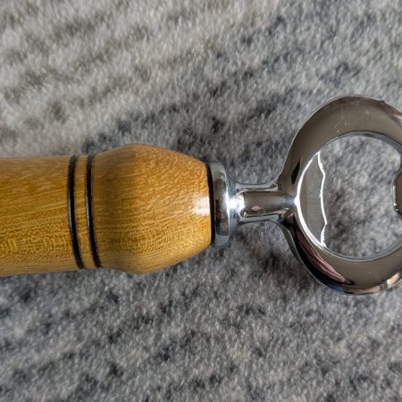 Handmade Iroko bottle opener with a stainless steel opener