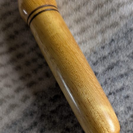 Handmade Iroko bottle opener with a stainless steel opener