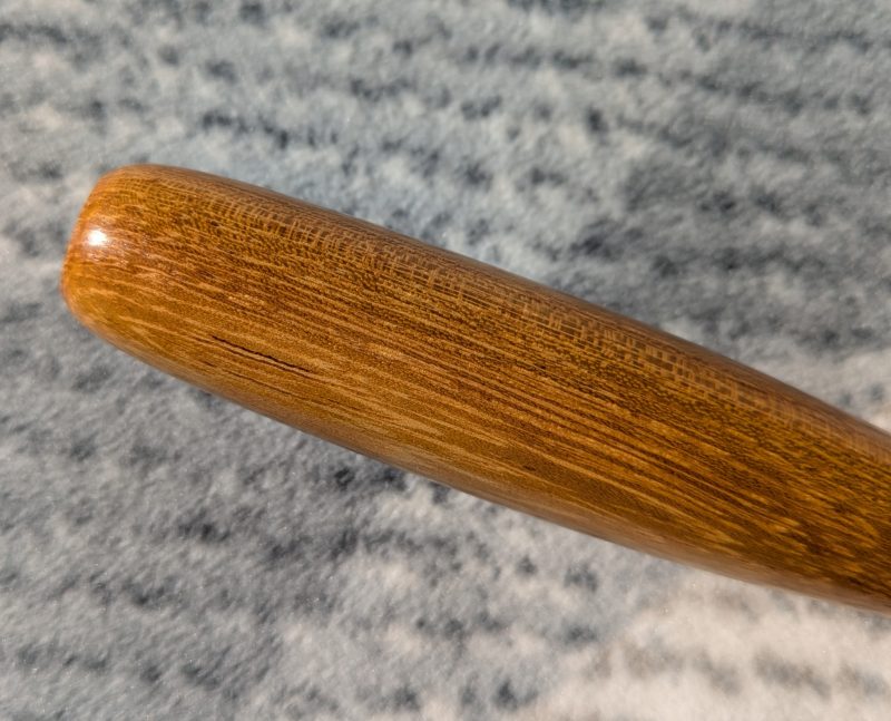 Handmade Iroko bottle opener with a stainless steel opener