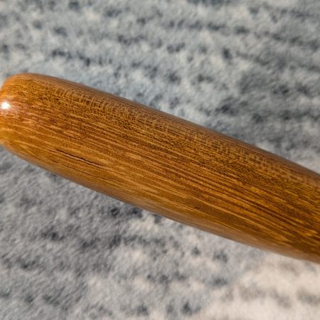 Handmade Iroko bottle opener with a stainless steel opener