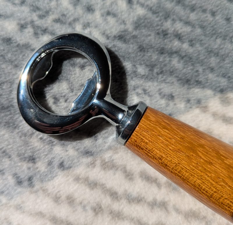 Handmade Iroko bottle opener with a stainless steel opener