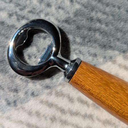 Handmade Iroko bottle opener with a stainless steel opener