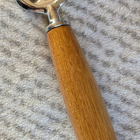 Handmade Iroko bottle opener with a stainless steel opener