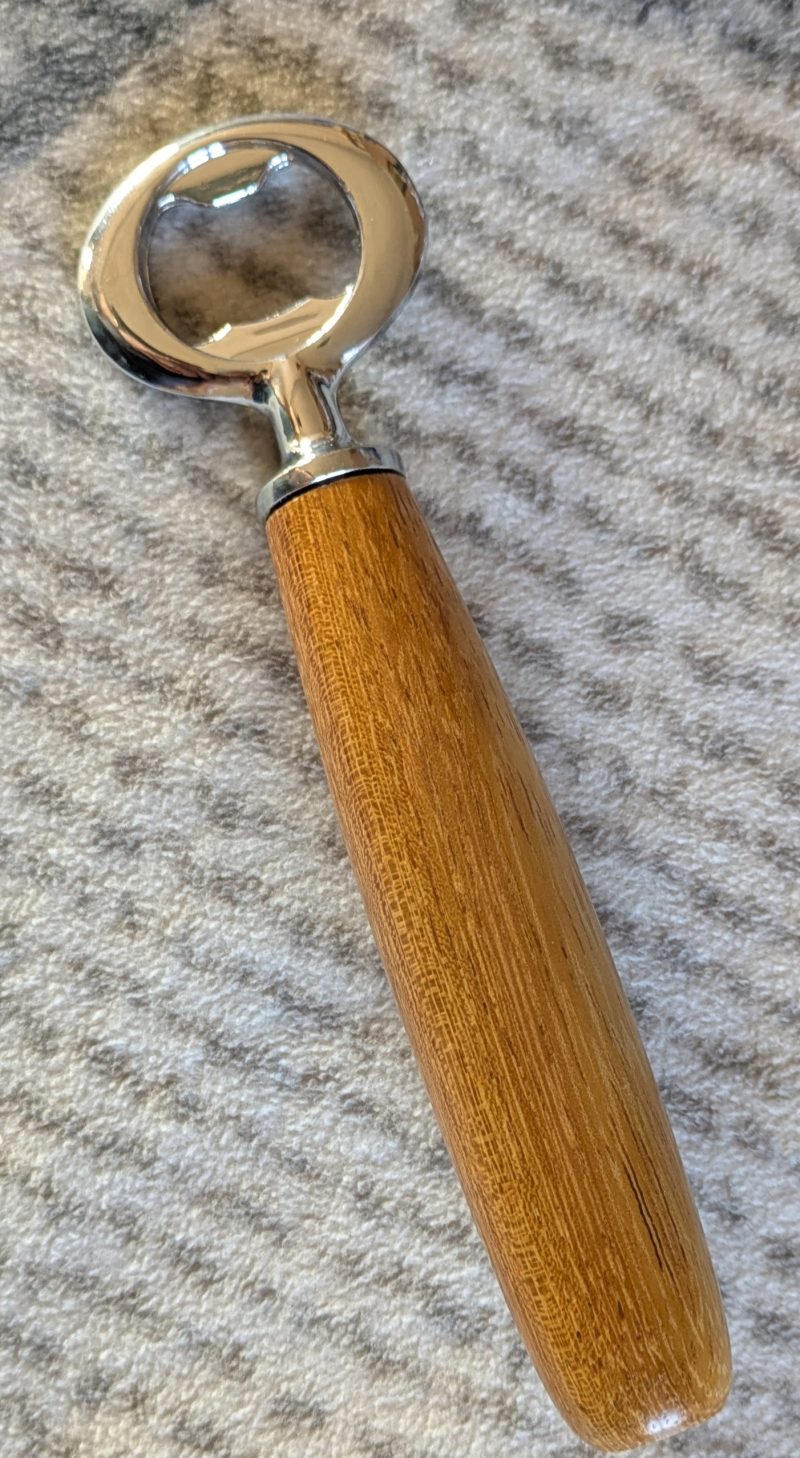 Handmade Iroko bottle opener with a stainless steel opener