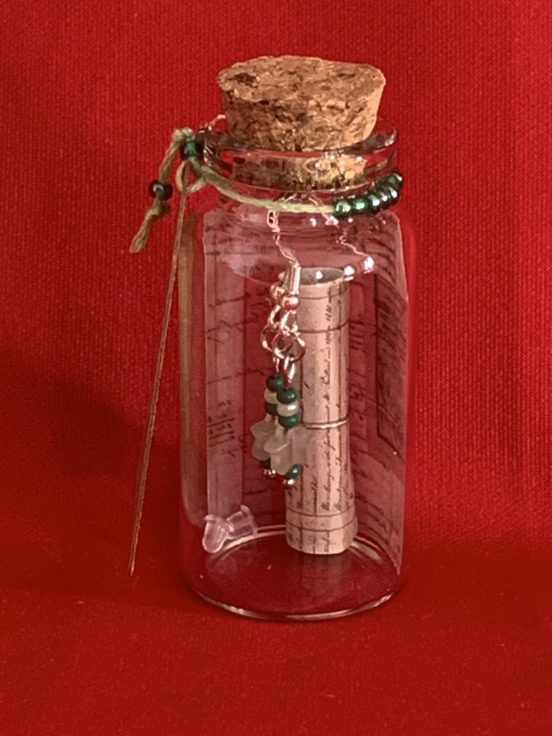 Lovely handmade sterling silver earrings with green stone stars & beads in a bottle with scroll