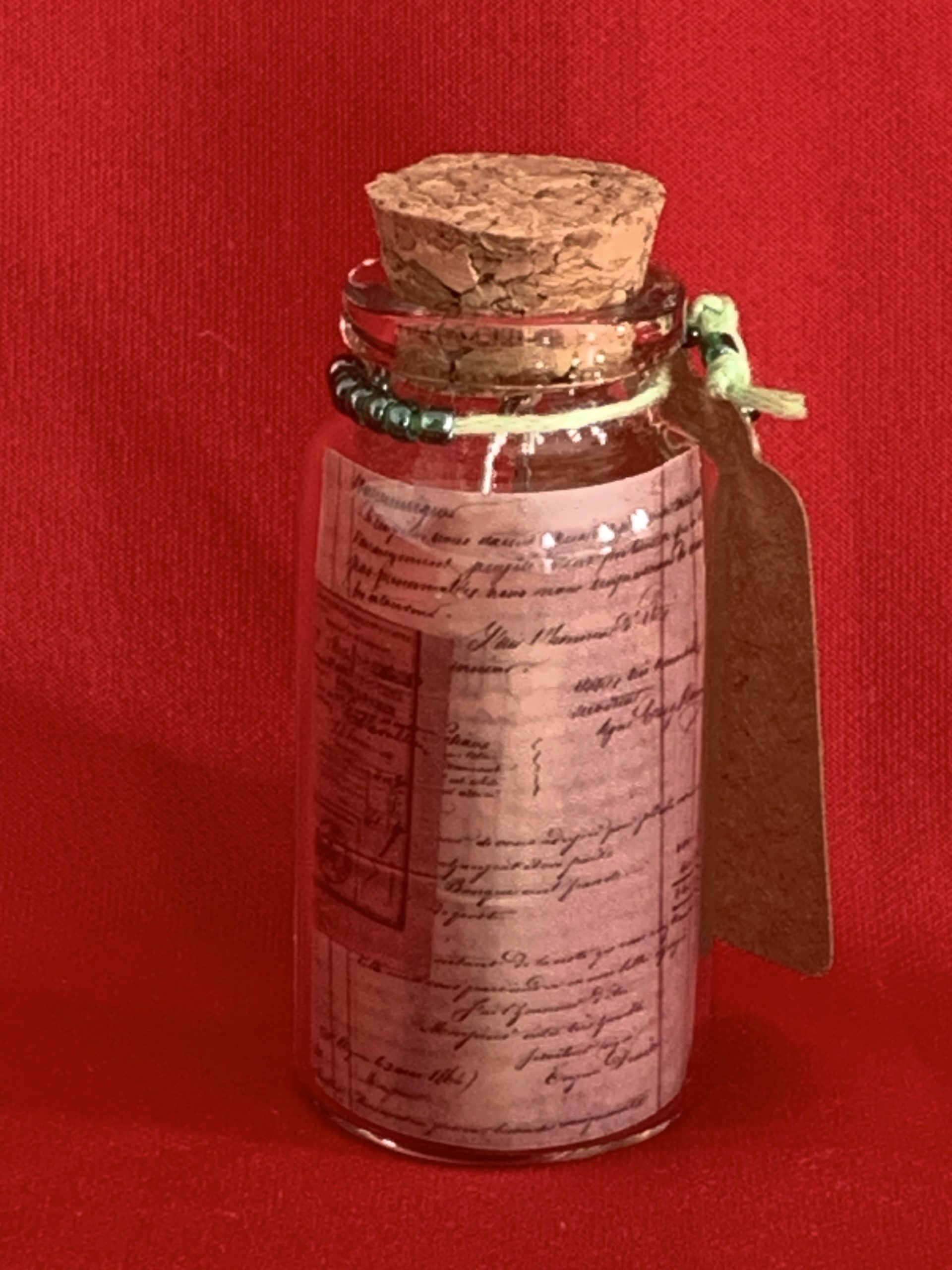 Lovely handmade sterling silver earrings with green stone stars & beads in a bottle with scroll