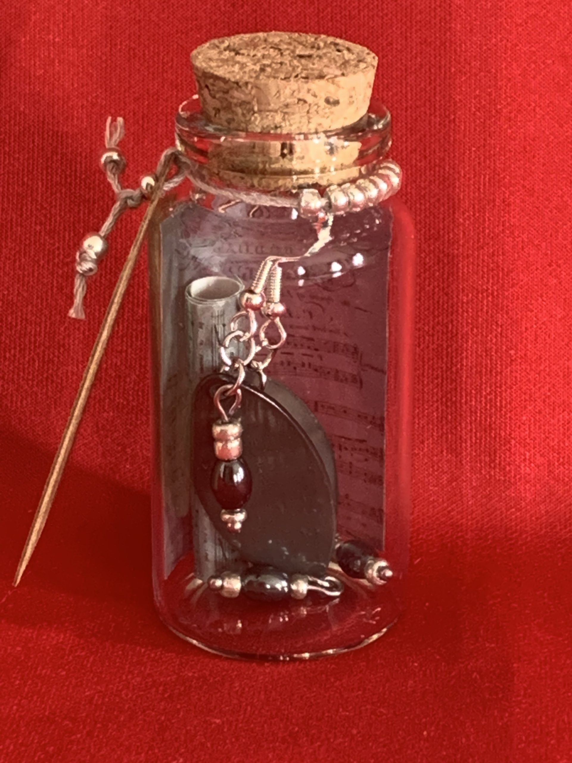 Lovely handmade sterling silver earrings with Hematite coloured beads in a bottle with scroll