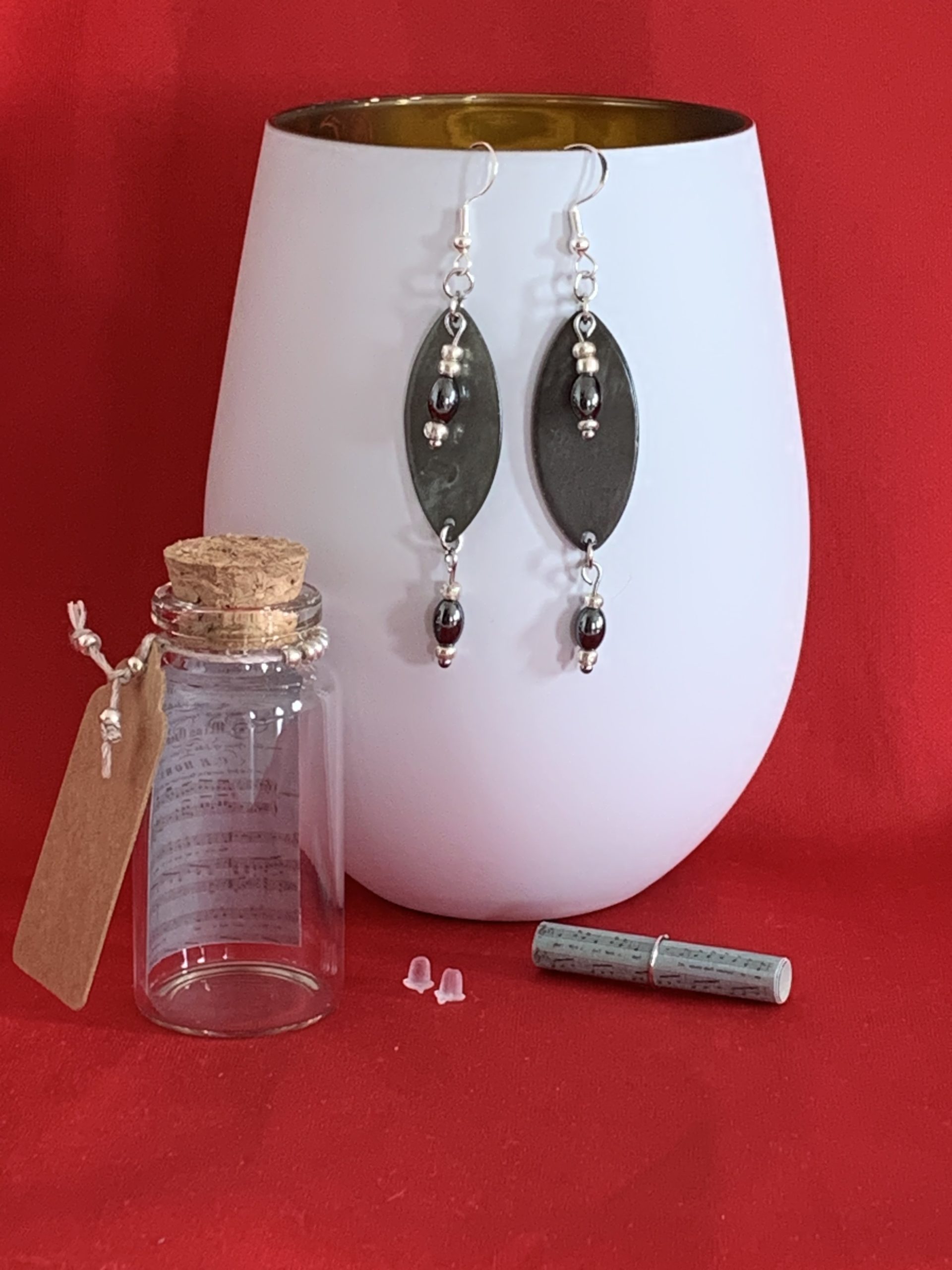 Lovely handmade sterling silver earrings with Hematite coloured beads in a bottle with scroll