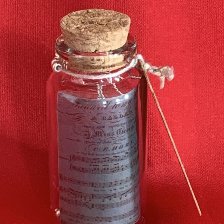 Lovely handmade sterling silver earrings with Hematite coloured beads in a bottle with scroll