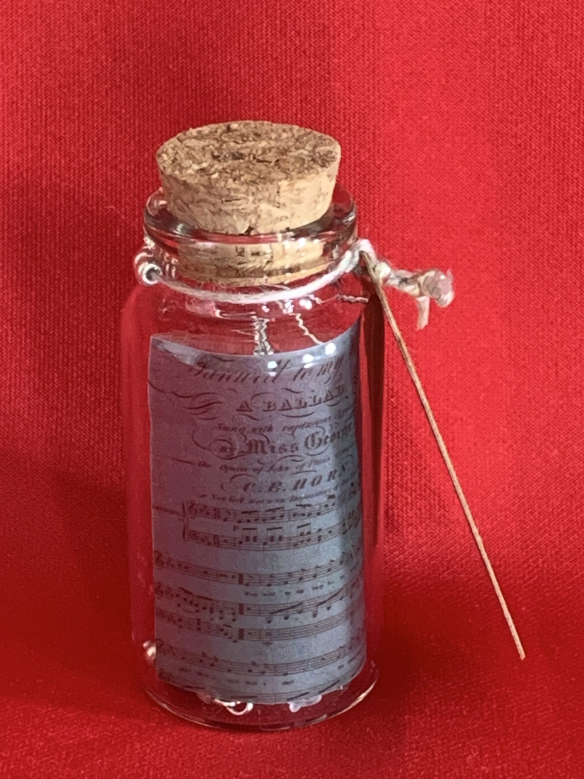 Lovely handmade sterling silver earrings with Hematite coloured beads in a bottle with scroll