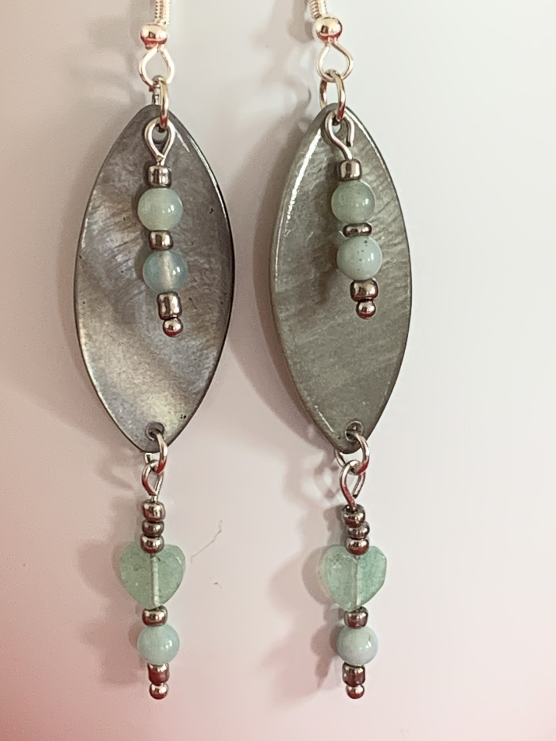 Lovely handmade sterling silver earrings with green stone hearts & beads in a bottle with scroll