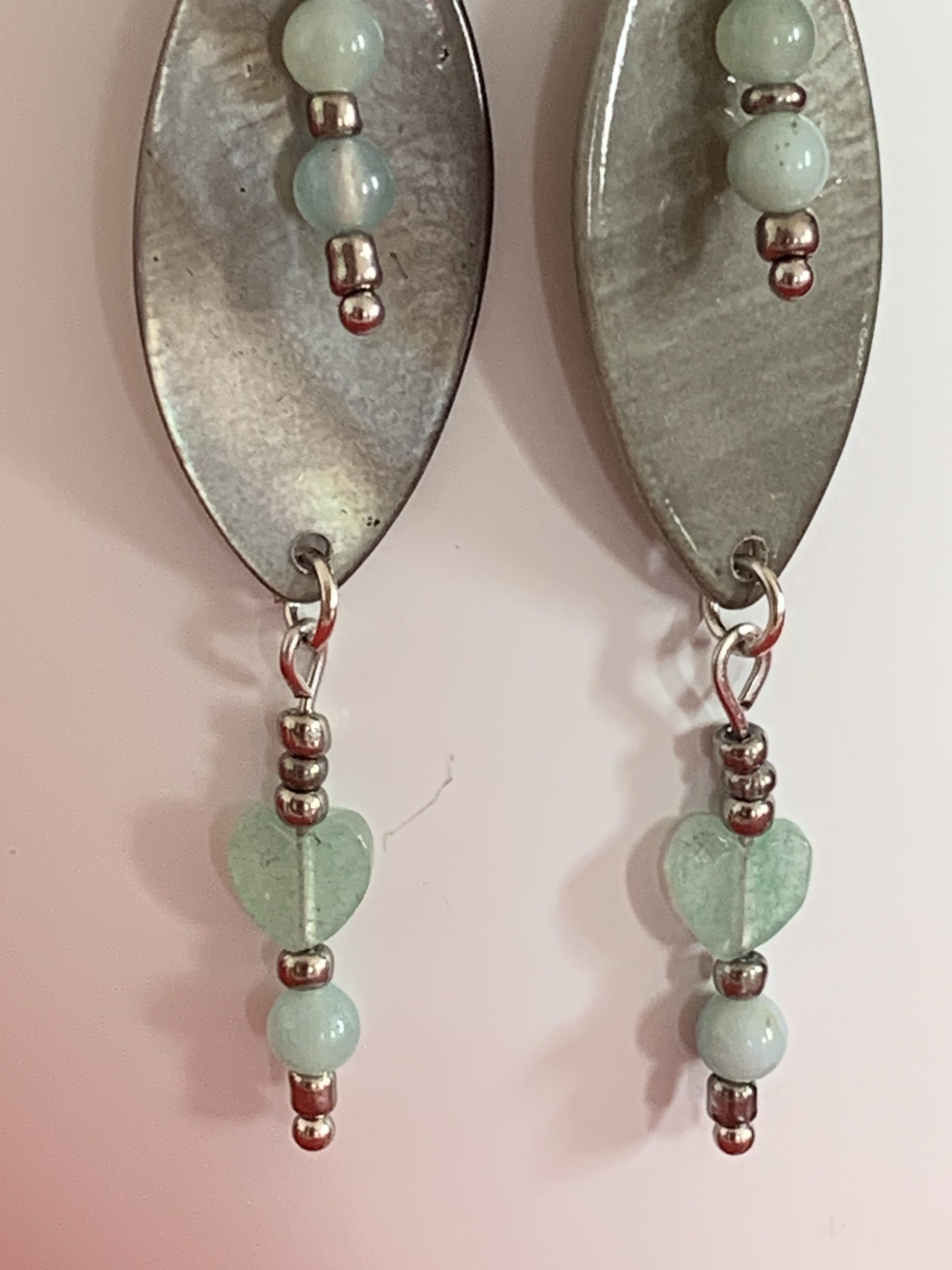 Lovely handmade sterling silver earrings with green stone hearts & beads in a bottle with scroll