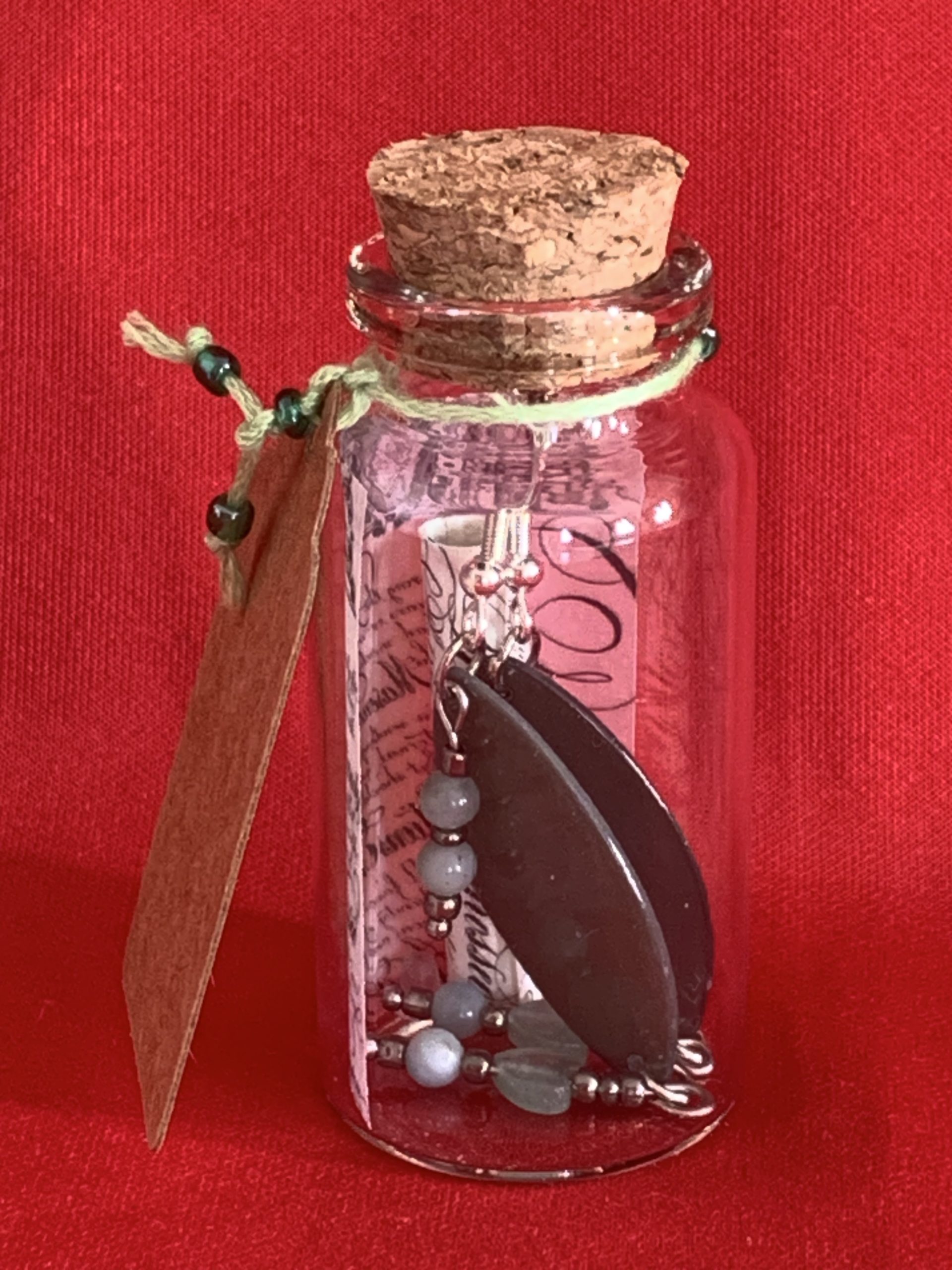 Lovely handmade sterling silver earrings with green stone hearts & beads in a bottle with scroll