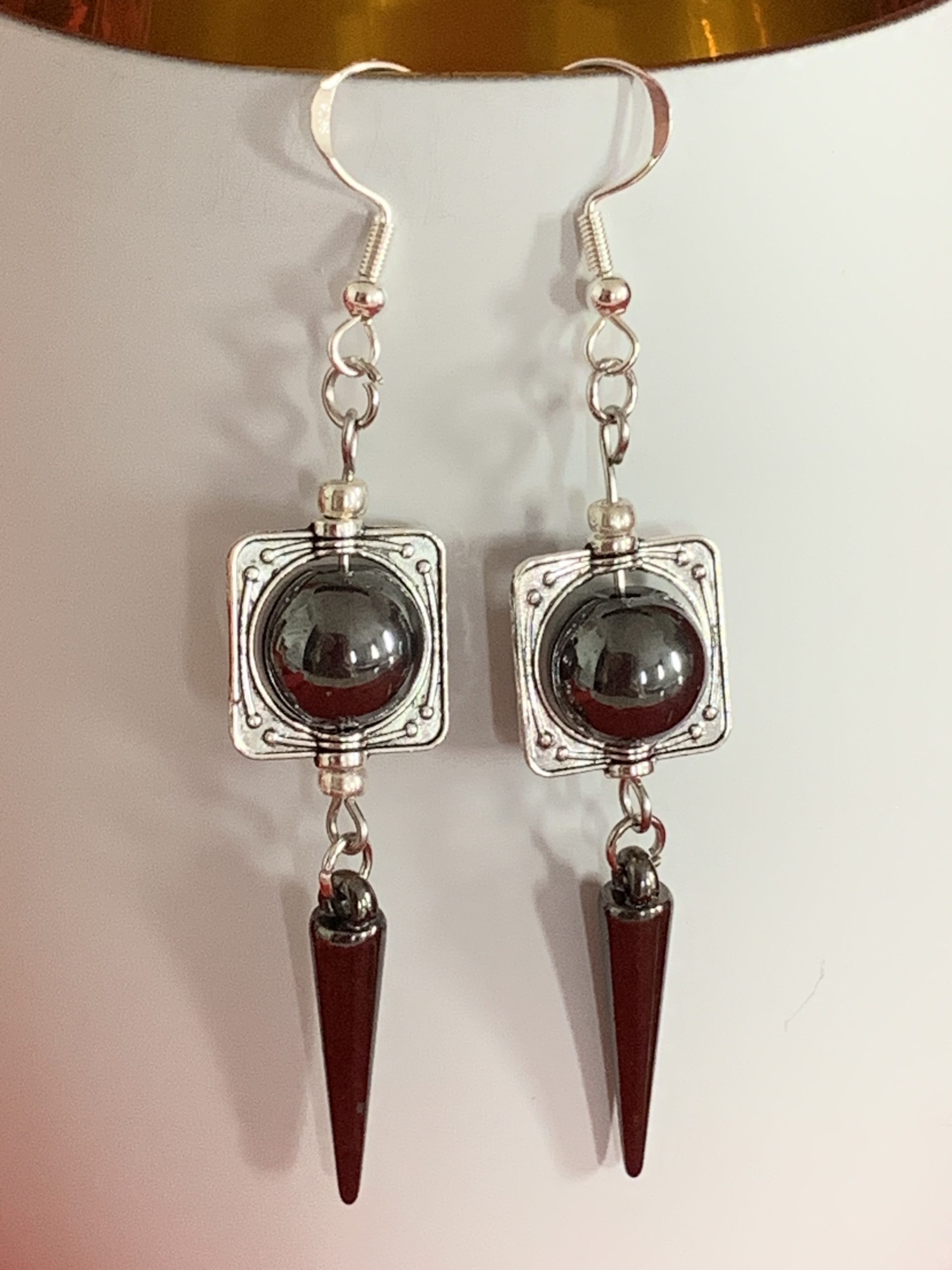 Lovely handmade sterling silver earrings with hematite coloured beads and spear drops in a bottle