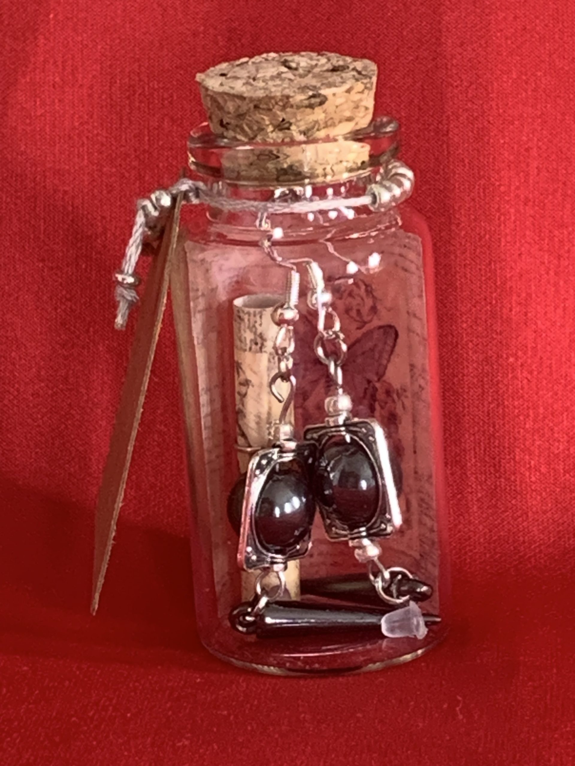 Lovely handmade sterling silver earrings with hematite coloured beads and spear drops in a bottle