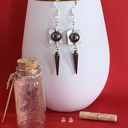 Lovely handmade sterling silver earrings with hematite coloured beads and spear drops in a bottle