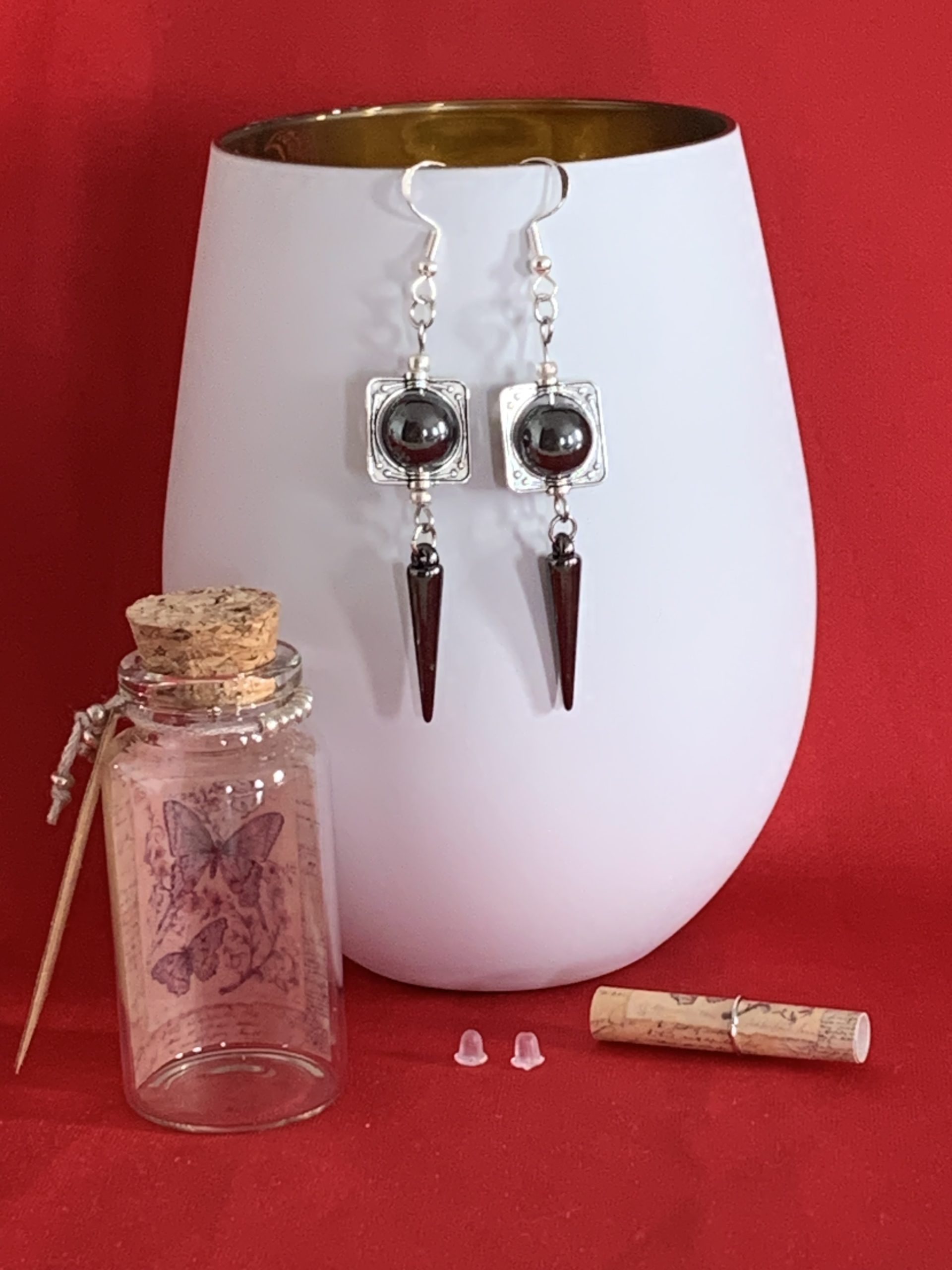 Lovely handmade sterling silver earrings with hematite coloured beads and spear drops in a bottle