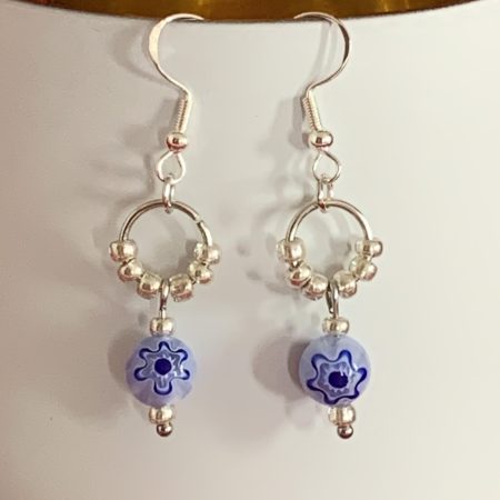 Lovely handmade sterling silver earrings with floral blue glass beads in a bottle with scroll