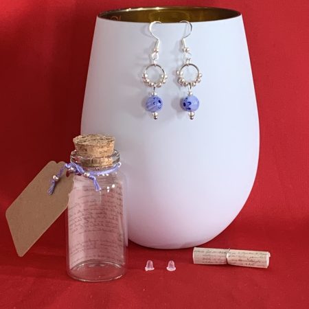 Lovely handmade sterling silver earrings with floral blue glass beads in a bottle with scroll
