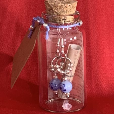 Lovely handmade sterling silver earrings with floral blue glass beads in a bottle with scroll