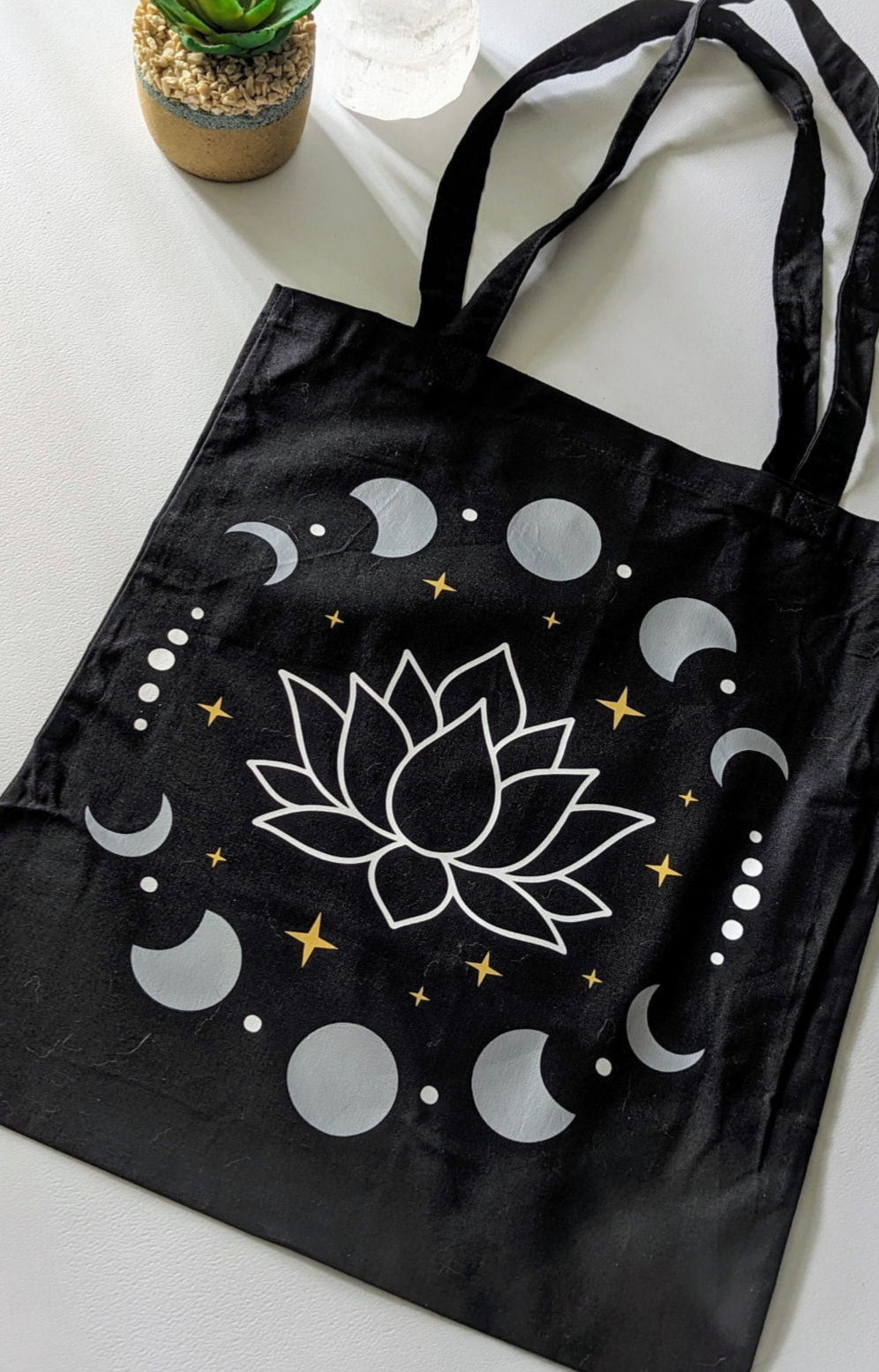 Black Tote Bag with A Mystical Lotus and Celestial Moon Phases design