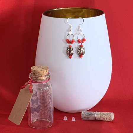 Lovely handmade sterling silver earrings with ladybirds & beads in a bottle with butterfly scroll