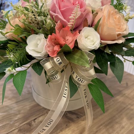 Silk flower arrangement in hatbox with pink, peach & ivory flowers