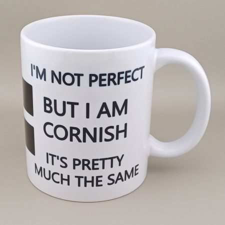 Image of 11oz mug with printed text on both sides of: I'm not perfect but I am Cornish It's pretty much the same. With image of St Piran's Flag.