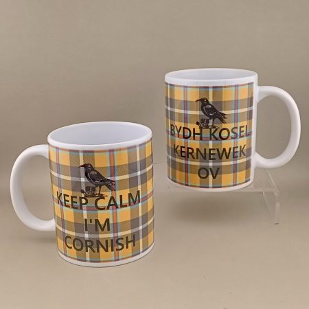 Image of two mugs in Keep Calm Tartan design showing each side. One side, 'Keep Calm I'm Cornish' in English and translated into Cornish on the other side.