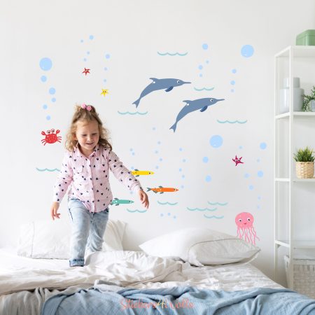 little girl in ocean theme bedroom