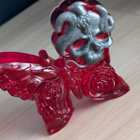 Red butterfly with grey skull