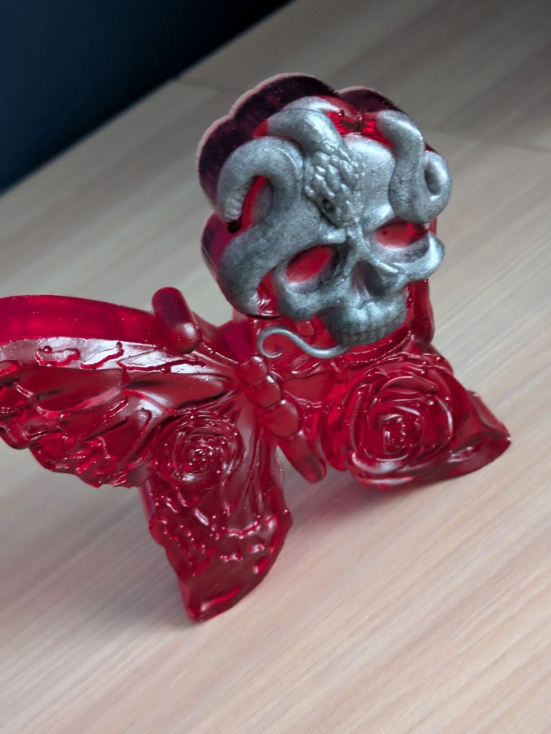 Red butterfly with grey skull