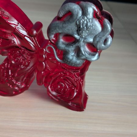 Red butterfly with grey skull