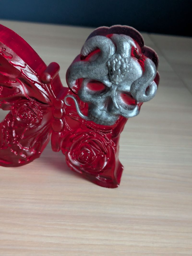 Red butterfly with grey skull
