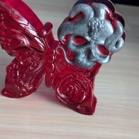 Red butterfly with grey skull