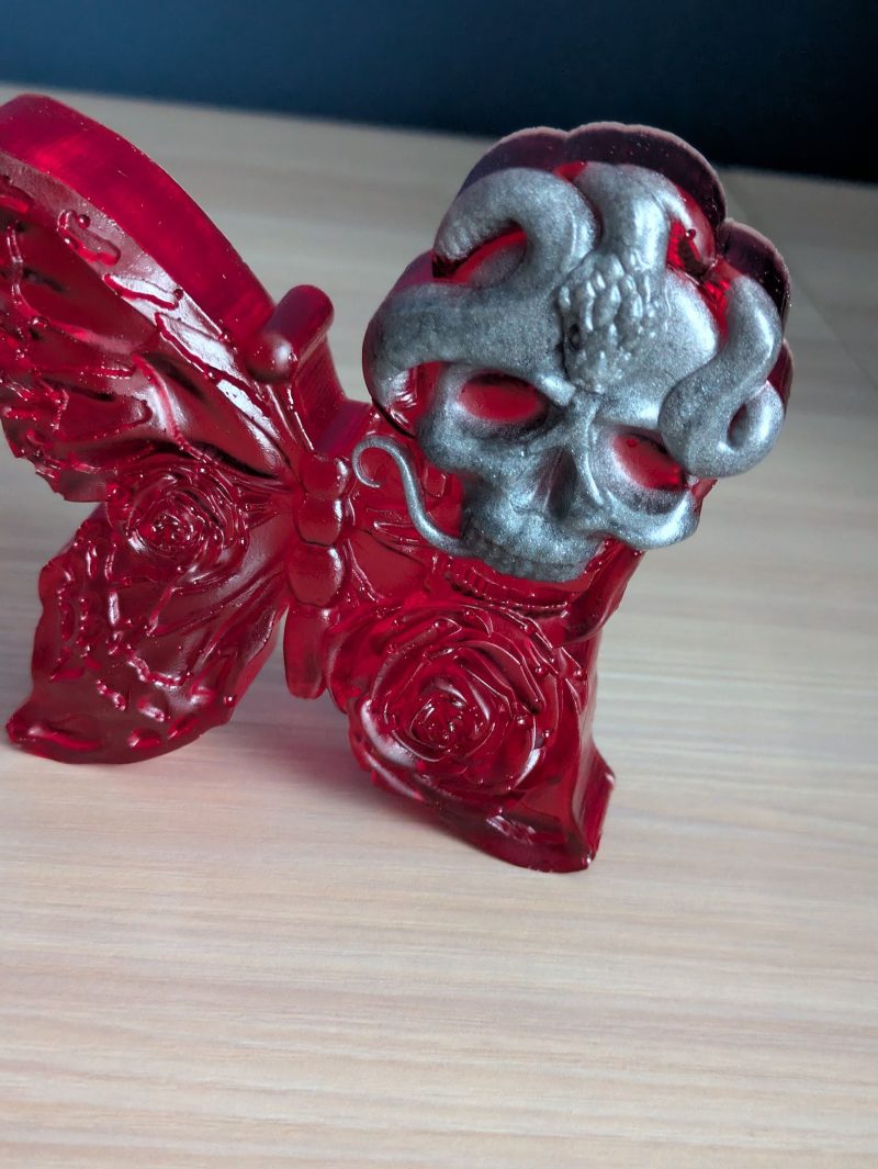 Red butterfly with grey skull