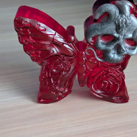 Red butterfly with grey skull