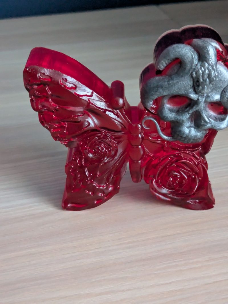 Red butterfly with grey skull