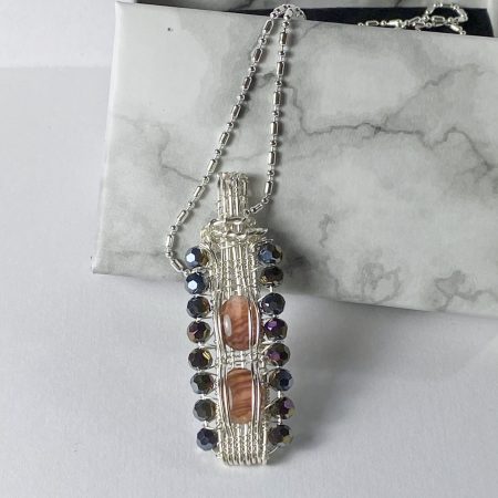 Unique wire-wrapped pendant with abalone shell and crystals