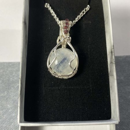 Wire-wrapped moonstone and garnet pendant