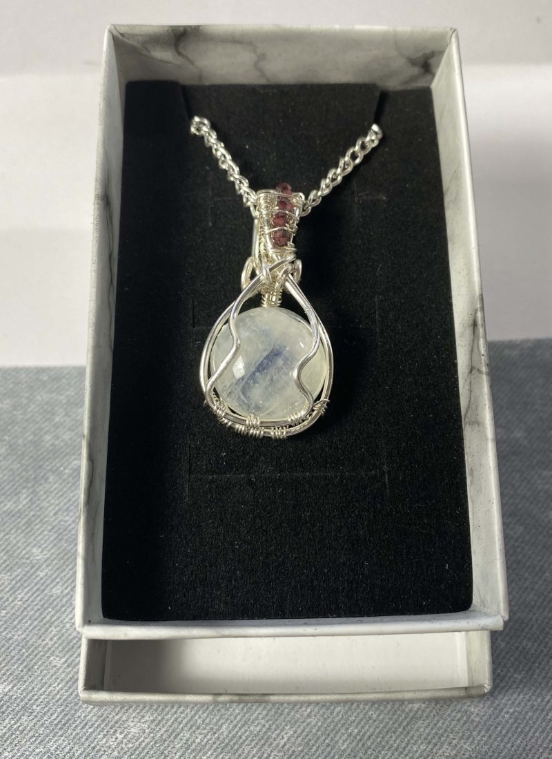 Wire-wrapped moonstone and garnet pendant