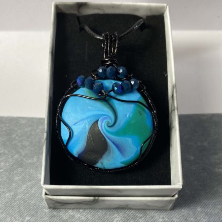 Pendant, Hand-made polymerclay bead wrapped in black coated copper wire