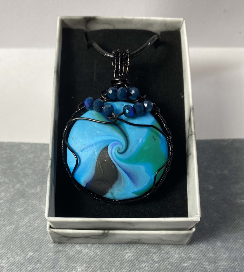 Pendant, Hand-made polymerclay bead wrapped in black coated copper wire