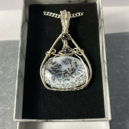 Absolutely stunning dendritic chalcedony wrapped in silver plated wire with haematite detail