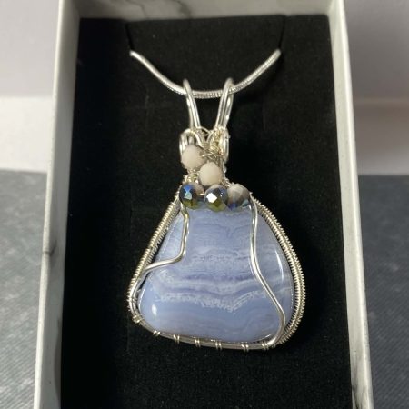 Beautiful blue lace agate wrapped in silver plated wire with bead detail