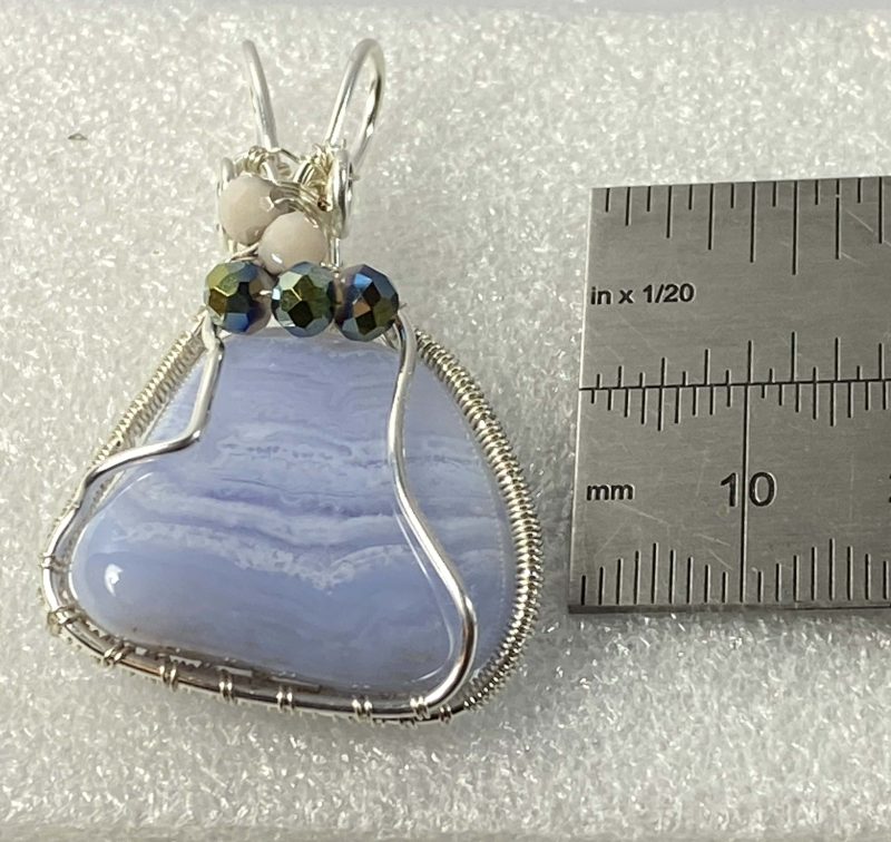 Beautiful blue lace agate wrapped in silver plated wire with bead detail